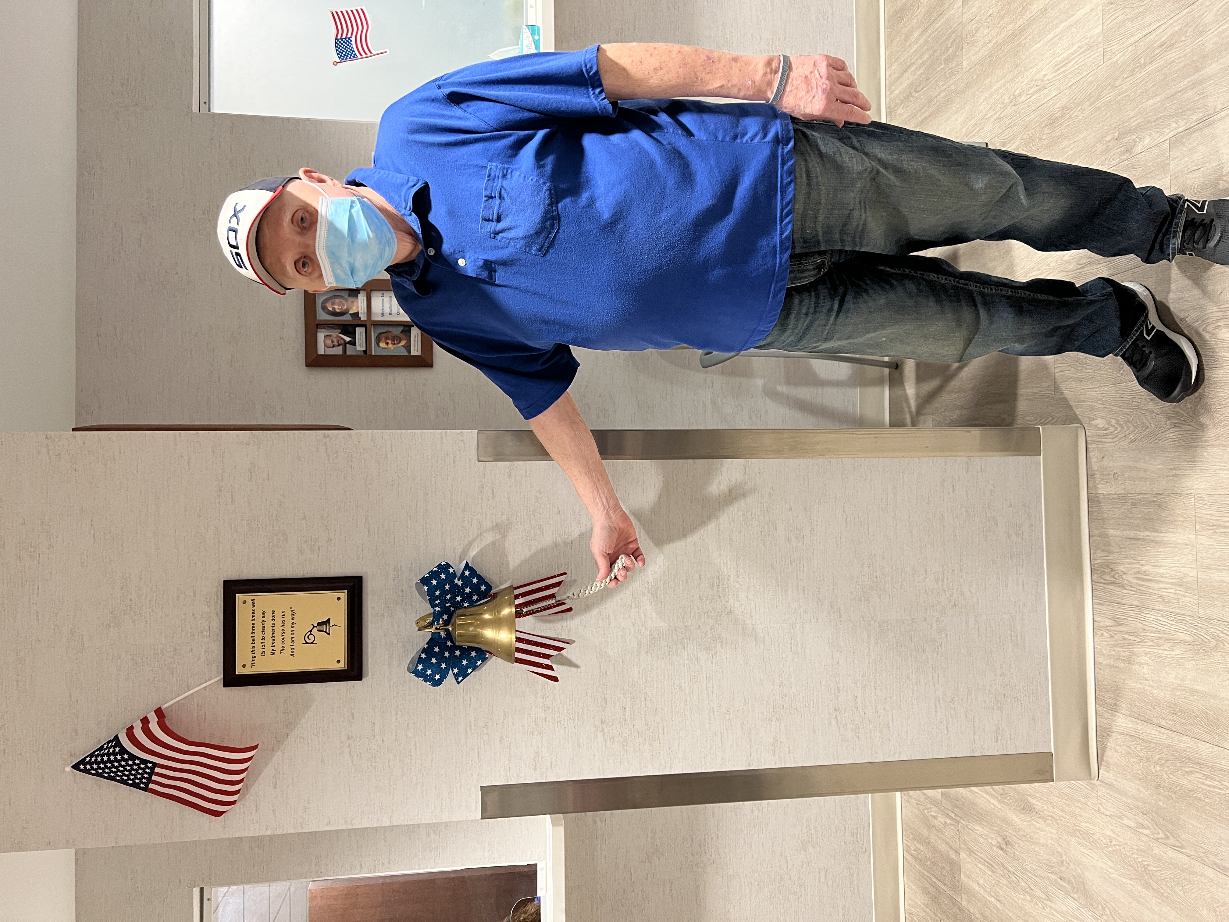 Jim Mazurek rings a bell signifying completion of part of his lung cancer treatment at Community Hospital in Munster.